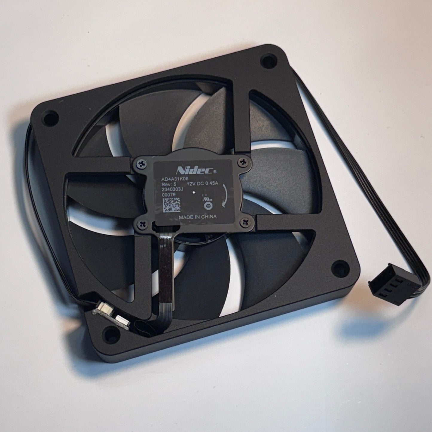 Black computer fan on a light gray background