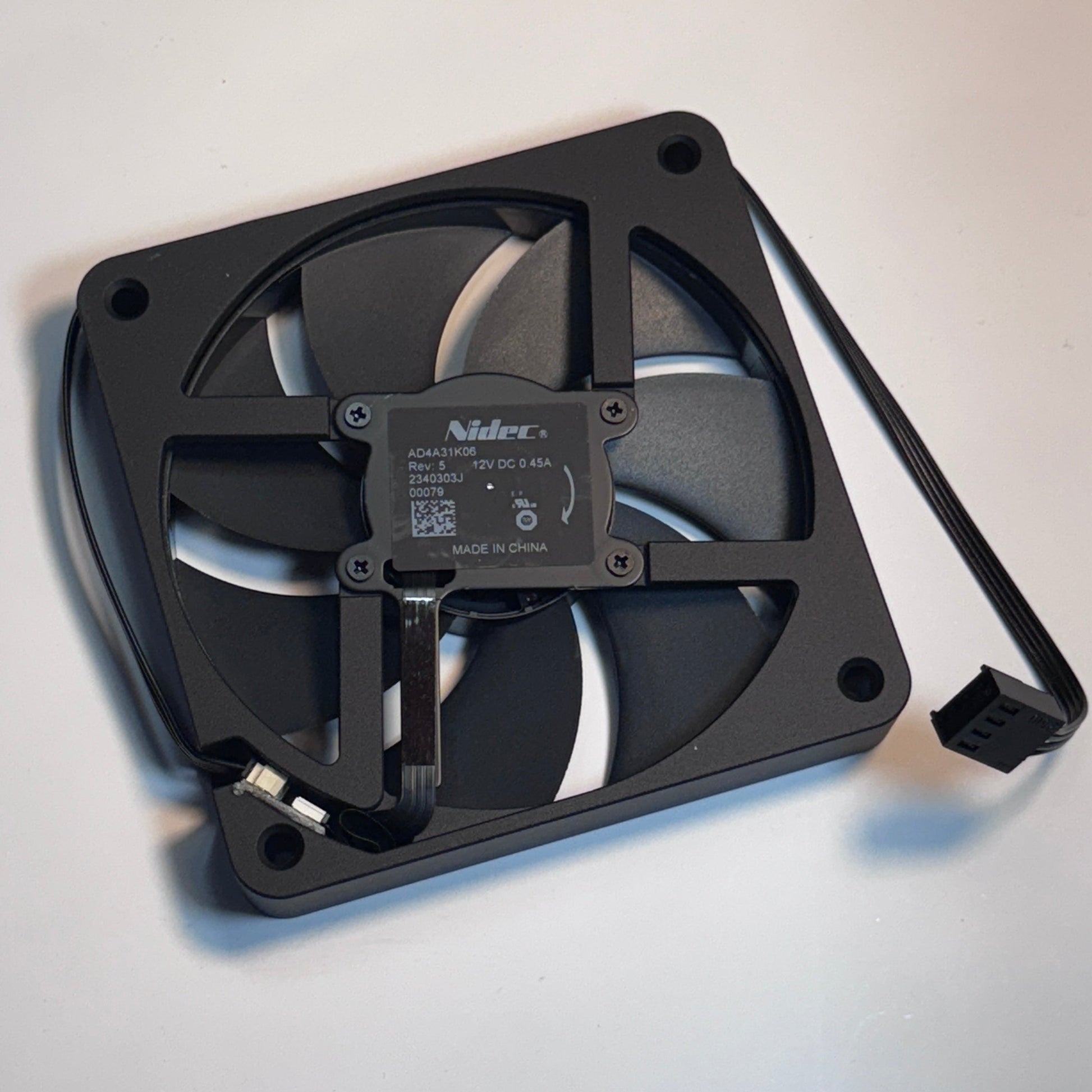 Black computer fan on a light gray background
